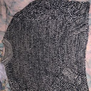 A baggy long sleeve knitted sweatshirt, heavy and a warm top layer nd breathable